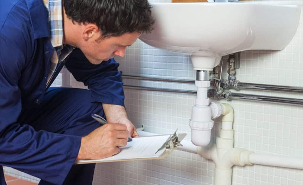professional plumber assessment of leak sink