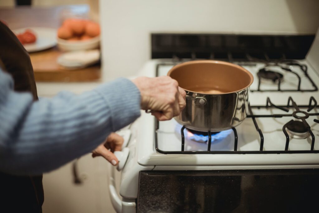 boiling water on the stove for unblocking a drain