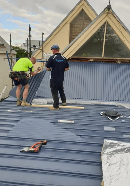 Holymess repairs happy roofers at work