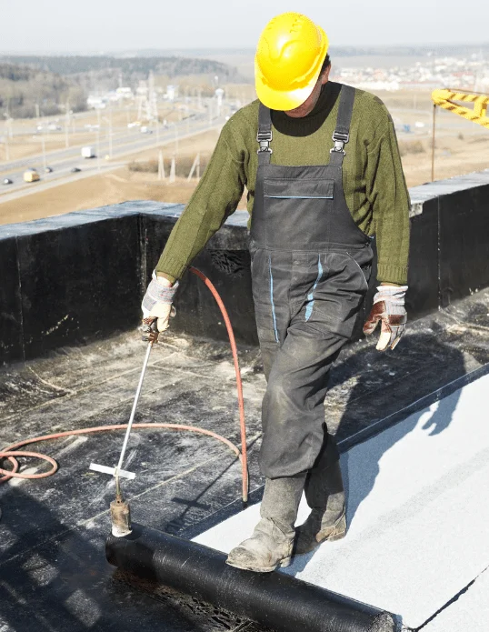 roofer in forest hill, vic doing emergency tarping on roof