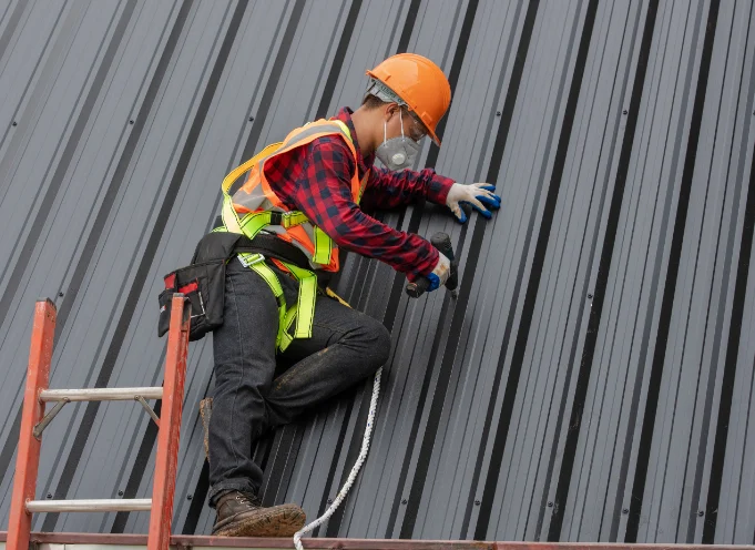  roofer doing restoration on roof